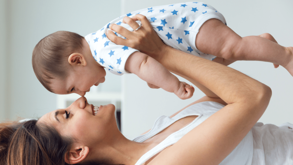 Mother playing with baby