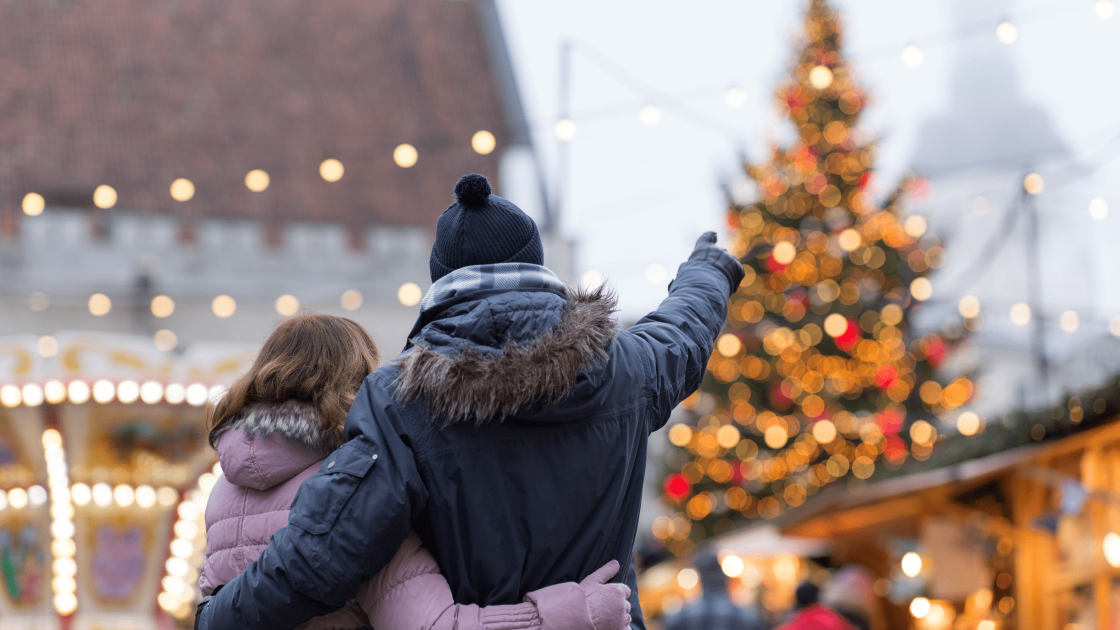 Couple at Christmas in front of Christmas tree