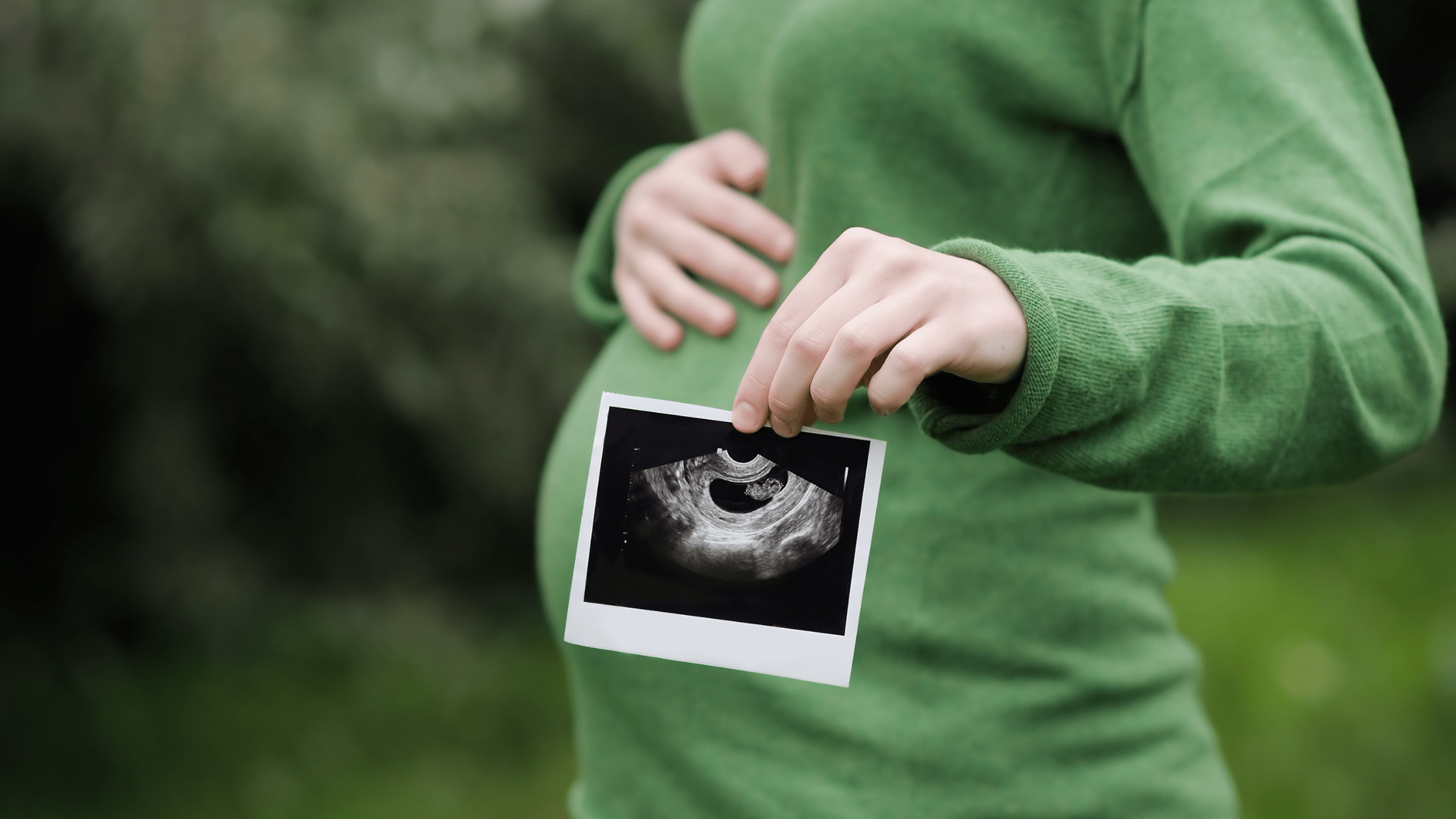 Woman holding baby scan
