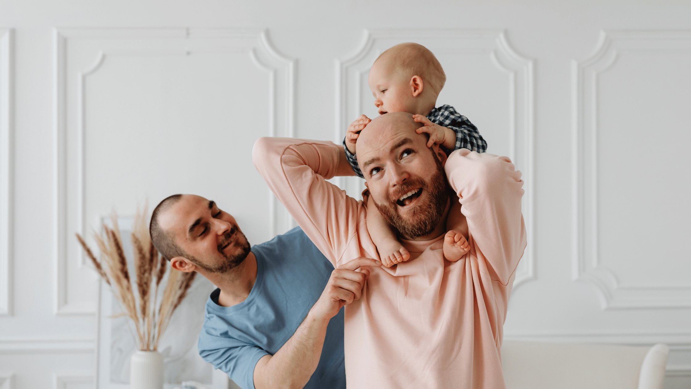 LGBTQIA+ parents. Gay couple with a baby. Same sex couple and fertility. LGBT+ family using surrogate mothers for fertility.  