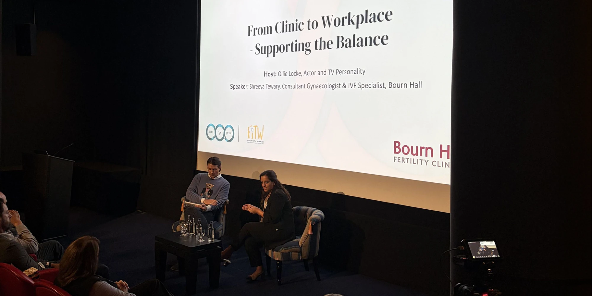 Ollie Locke and Shreeya Tewary of Bourn Hall on stage for From Clinic to Workplace